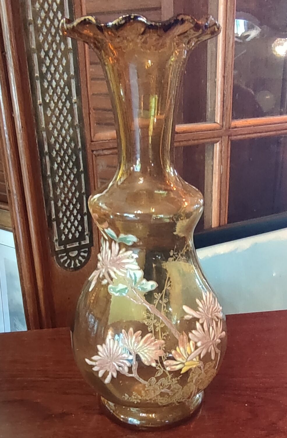 Old vase with enamelled floral decoration