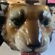 Lion's head pot cover in earthenware