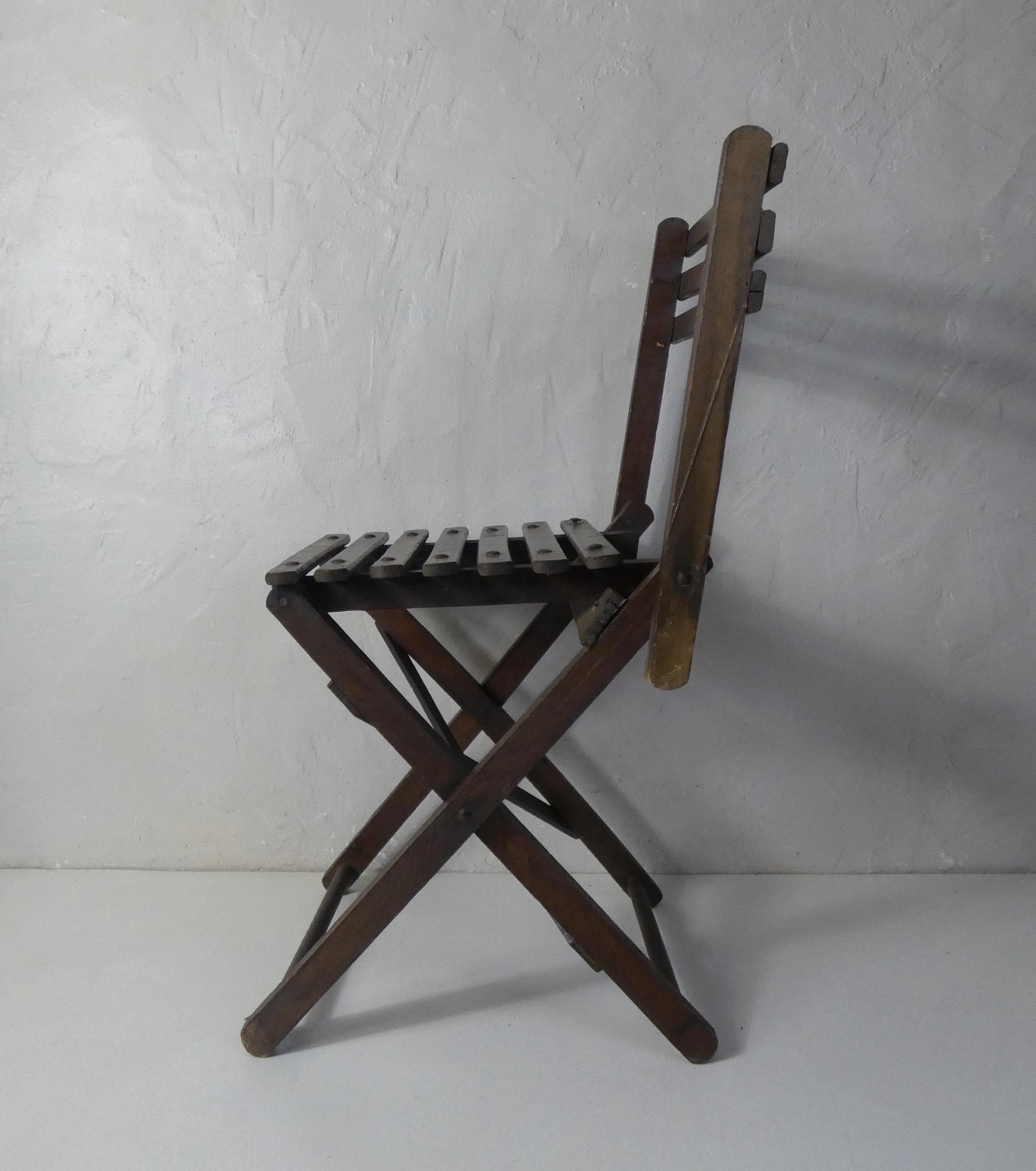 Old folding wooden chair for children