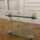 Glass side table with gold decorations.