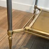 Coffee table in brass, brushed steel, glass, and gilded eglomisé mirror from Maison Jansen.