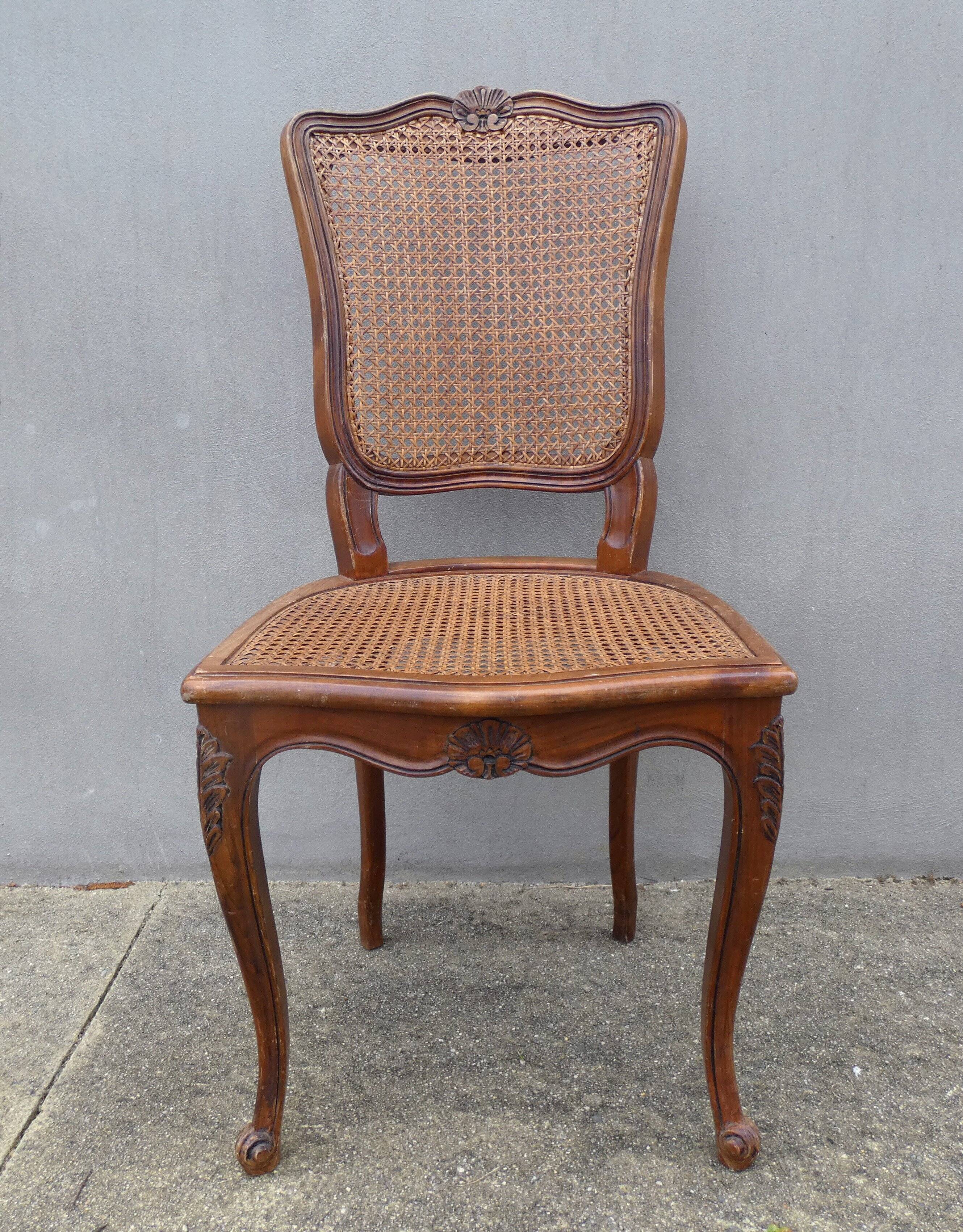 4 caned wooden chairs