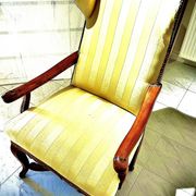 Wingback armchair in walnut in the French Regency style with stretcher in