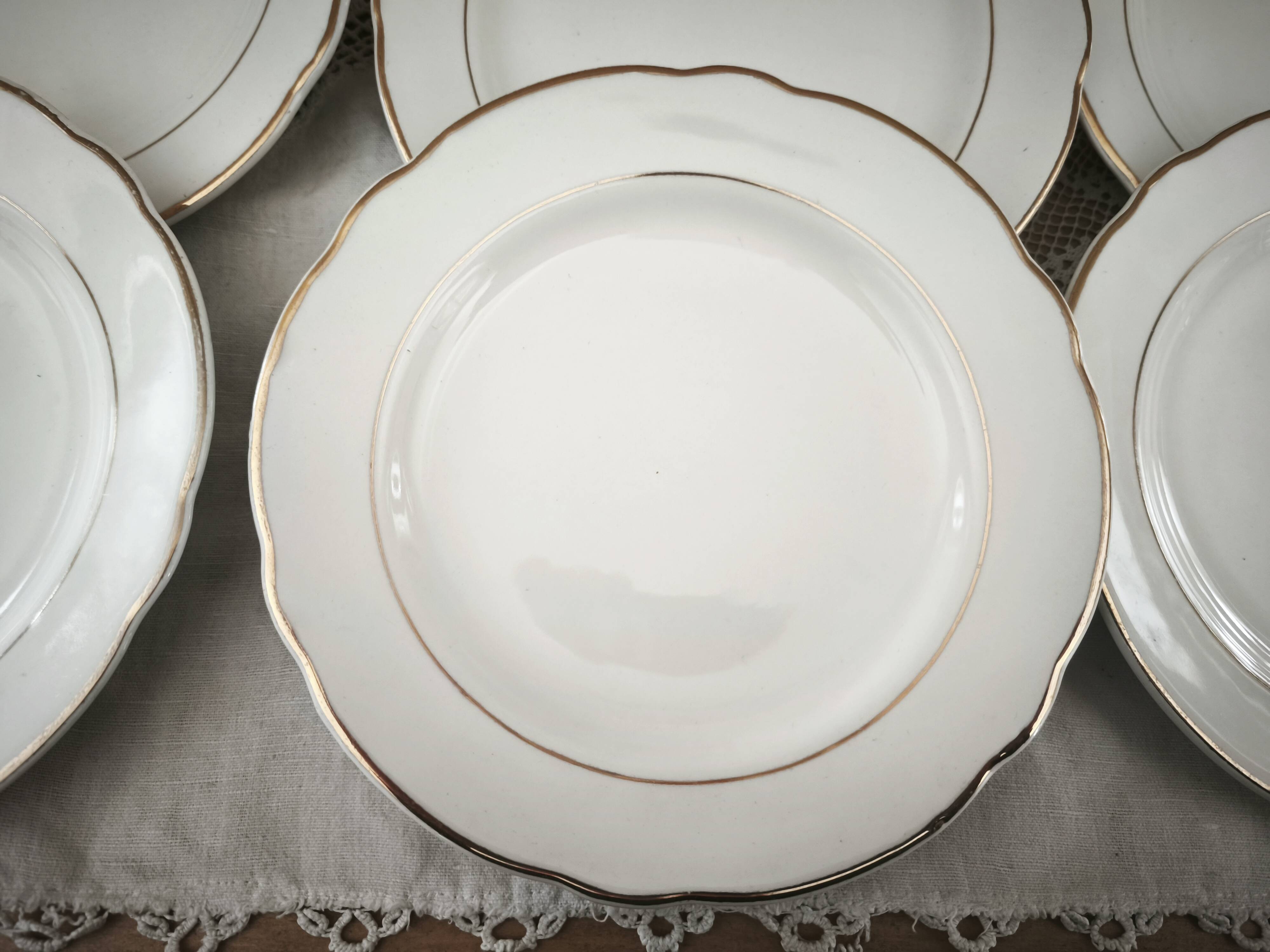 Set of 12 white earthenware dessert plates with a gold rim from Sarreguemines.