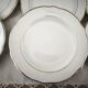 Set of 12 white earthenware dessert plates with a gold rim from Sarreguemines.