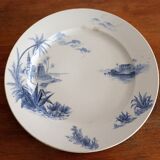 Flat in iron earth "views of the Orient" faience of Gien