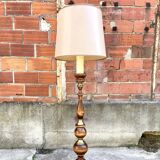 Floor lamp in wood and metal with brushed brass finish