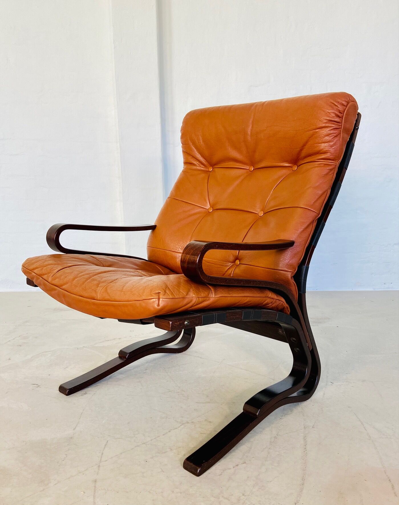 Vintage Scandinavian cognac lounge chair by Oddvin Rykken