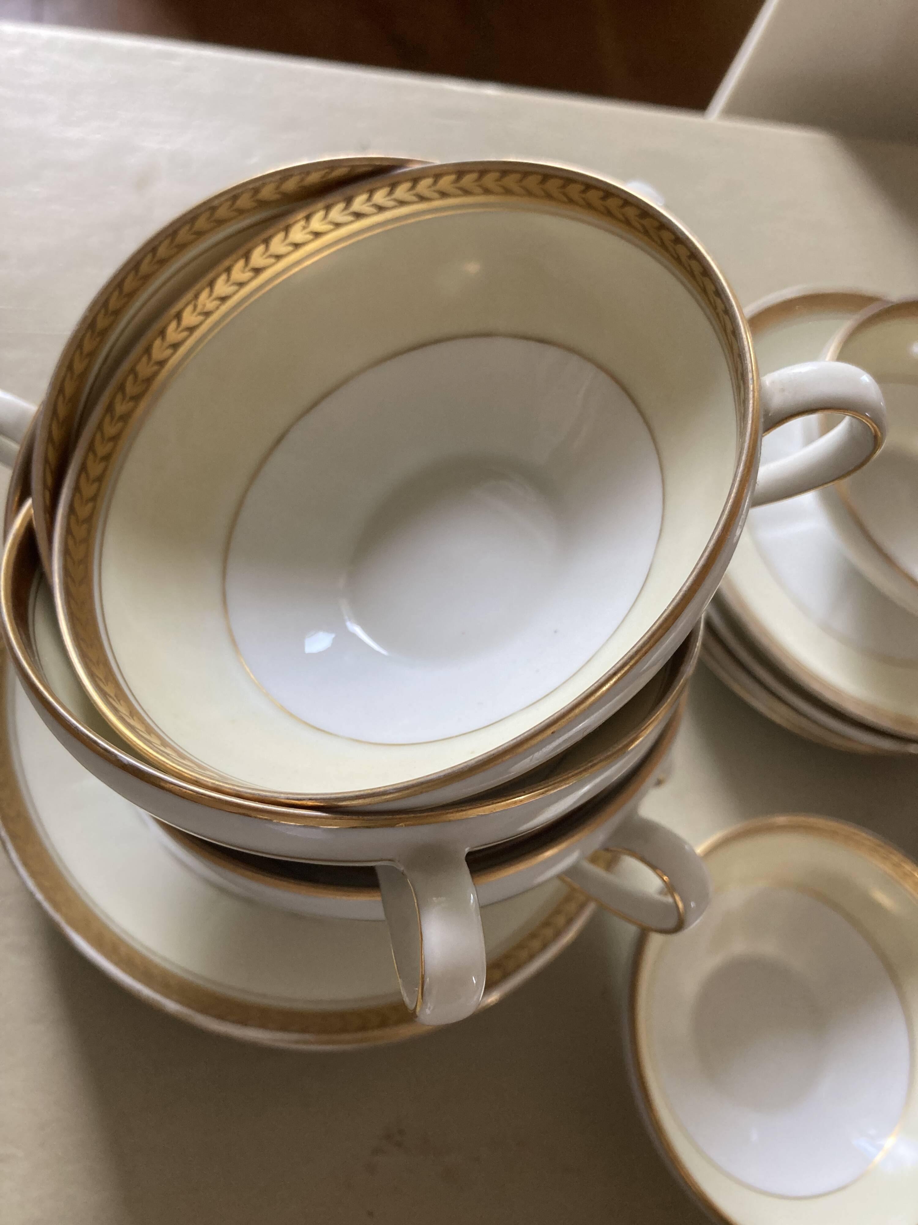 Vintage Limoges porcelain chocolate teacups in pastel yellow and gold