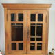 Antique walnut display cabinet from the 20th century.