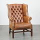 Fauteuil Chesterfield anglais classique en cuir de vachette couleur cognac clair