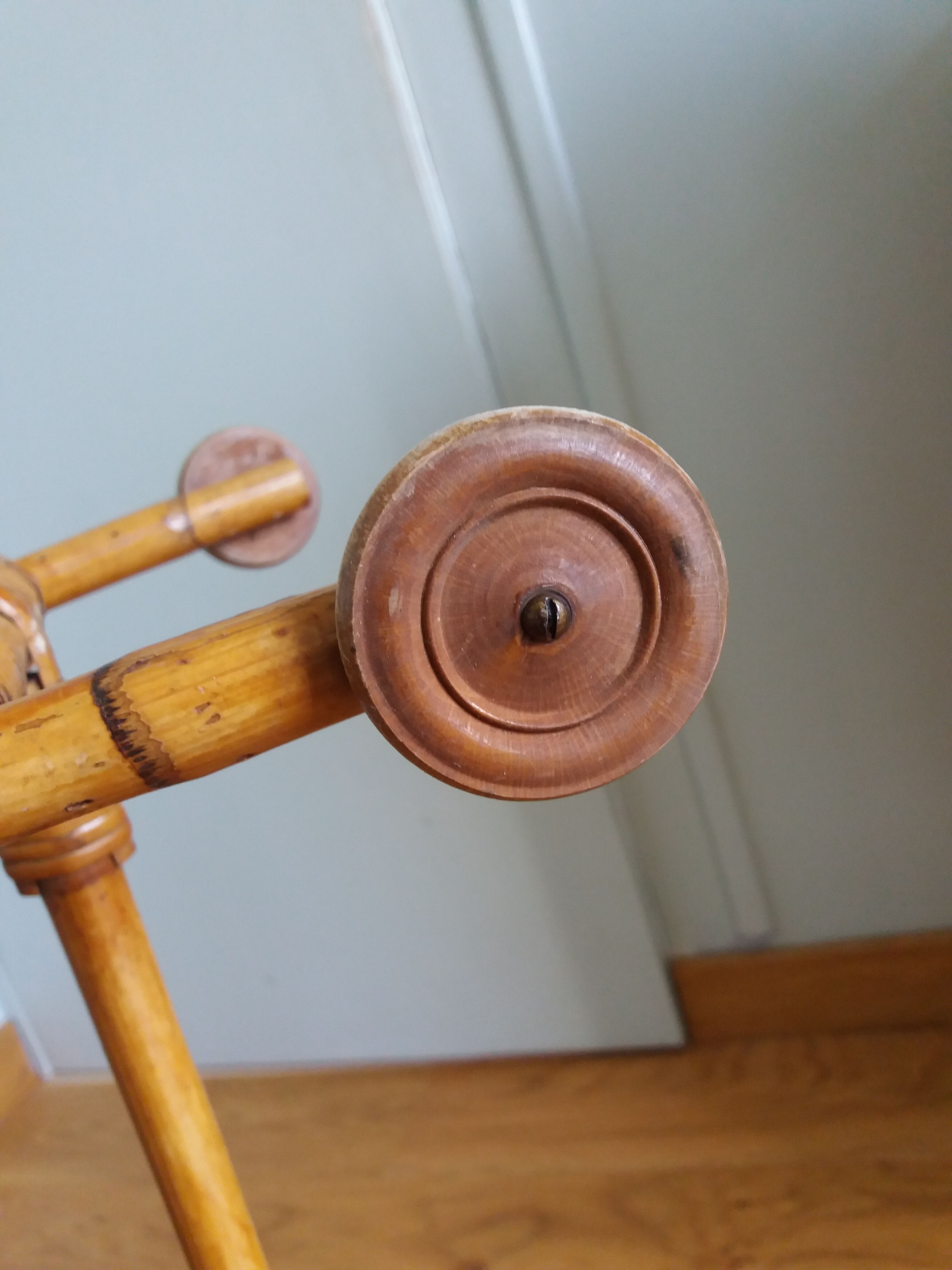 Rattan wicker cradle on wooden wheels