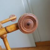 Rattan wicker cradle on wooden wheels