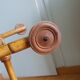 Rattan wicker cradle on wooden wheels
