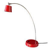 Vintage red lamp with a curved arm