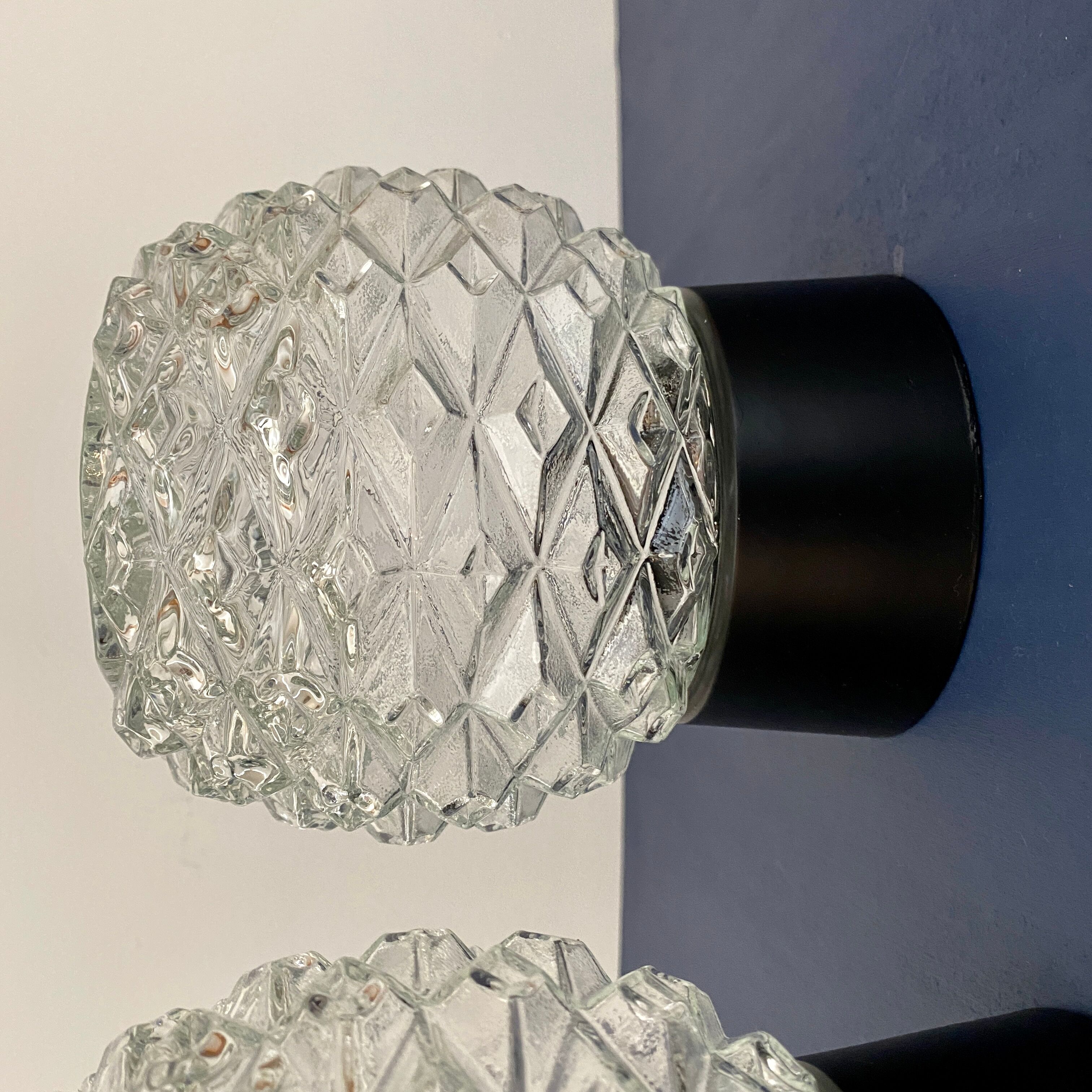 Pair of vintage wall lamps in molded glass and thermoplastic