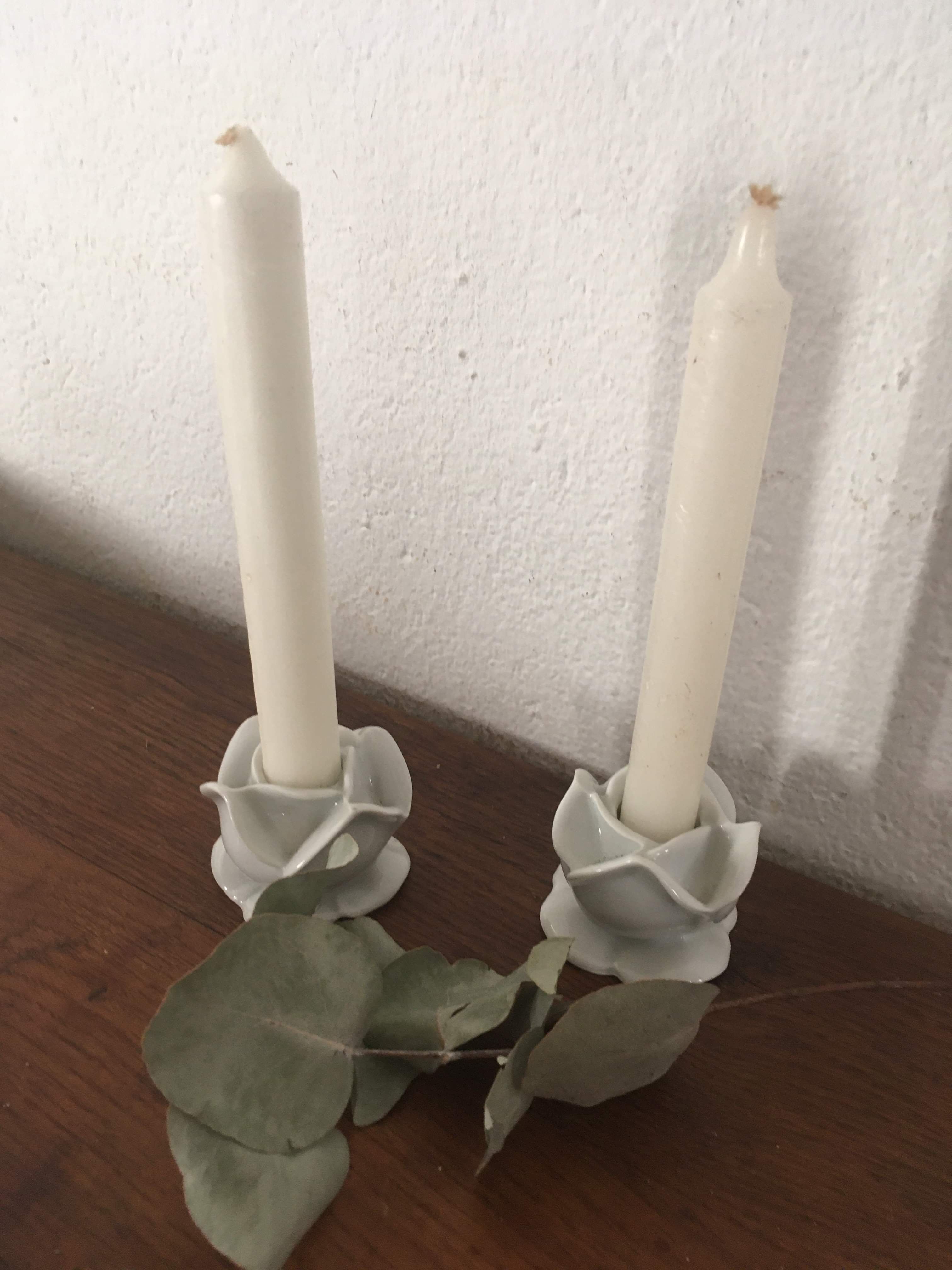 Two white porcelain flower candlesticks