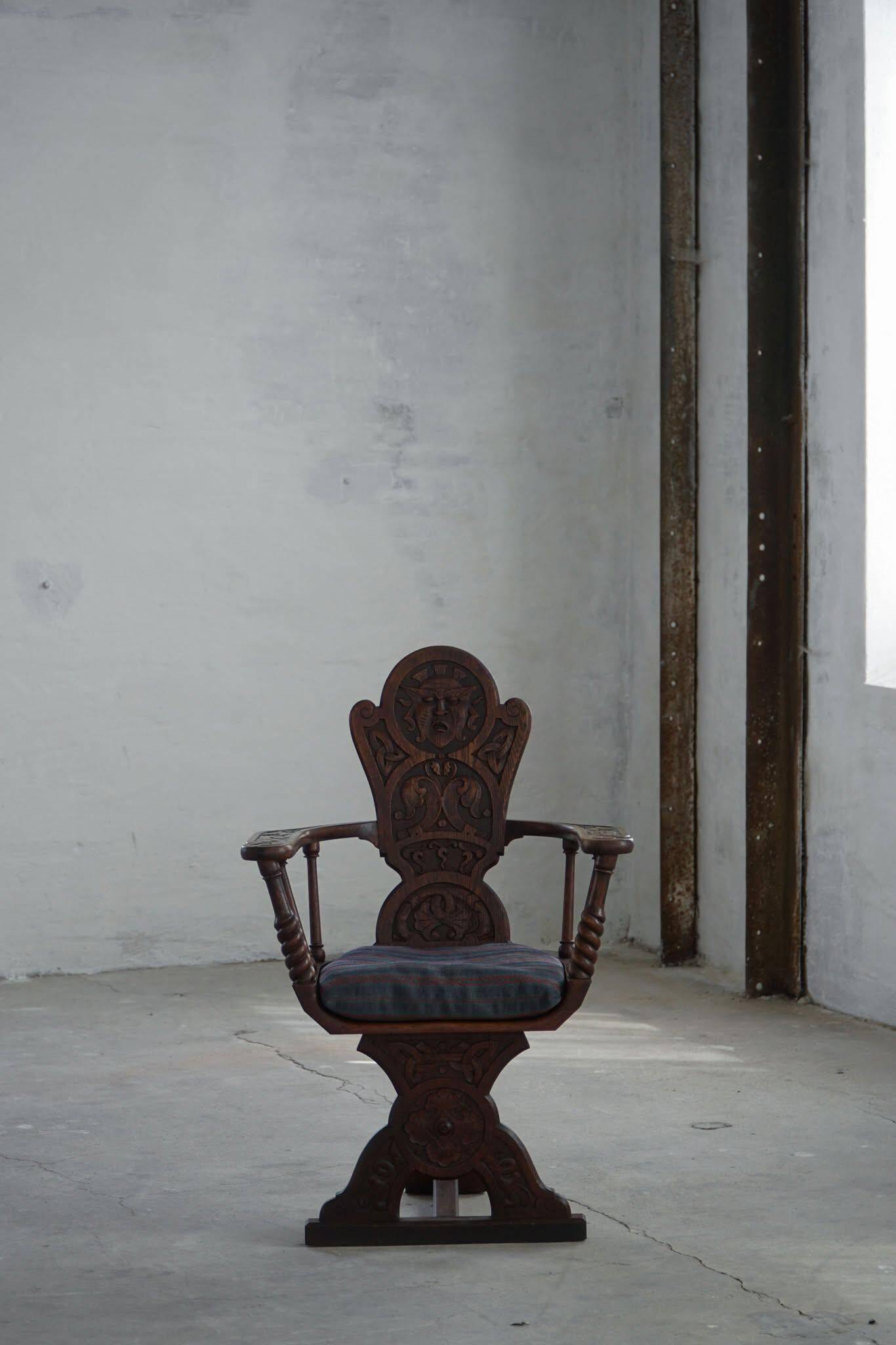 Scandinavian armchair in solid oak with cushion, folk art, early 19th century.