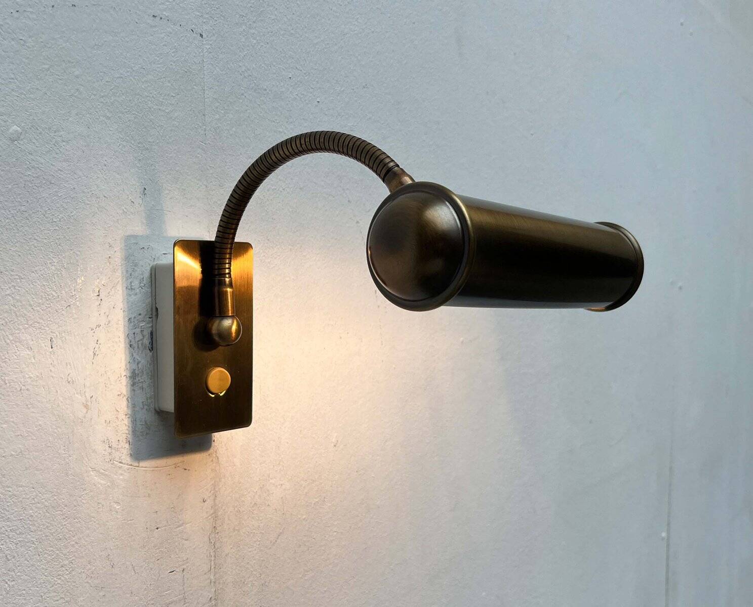 Vintage German brass patinated wall lamp with a gooseneck design by Honsel, 1970s.