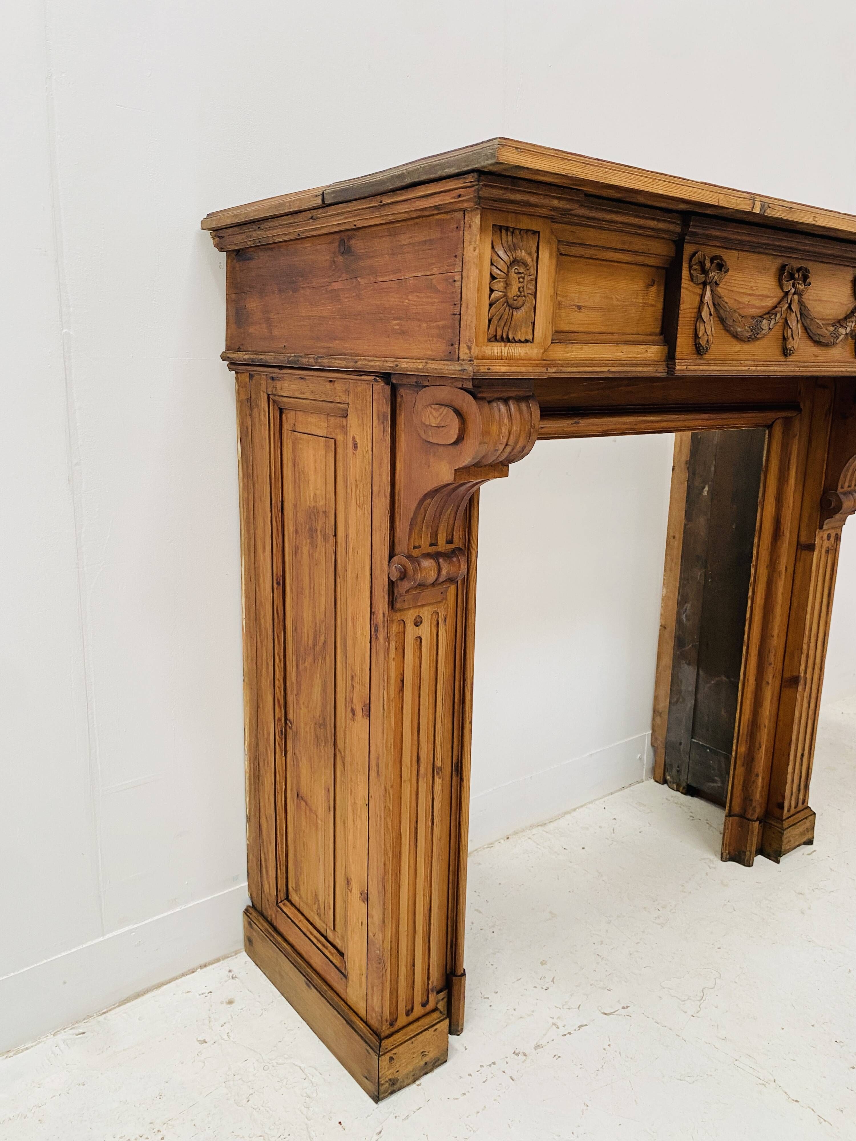 Louis XVI style fireplace in solid fir, 19th century.