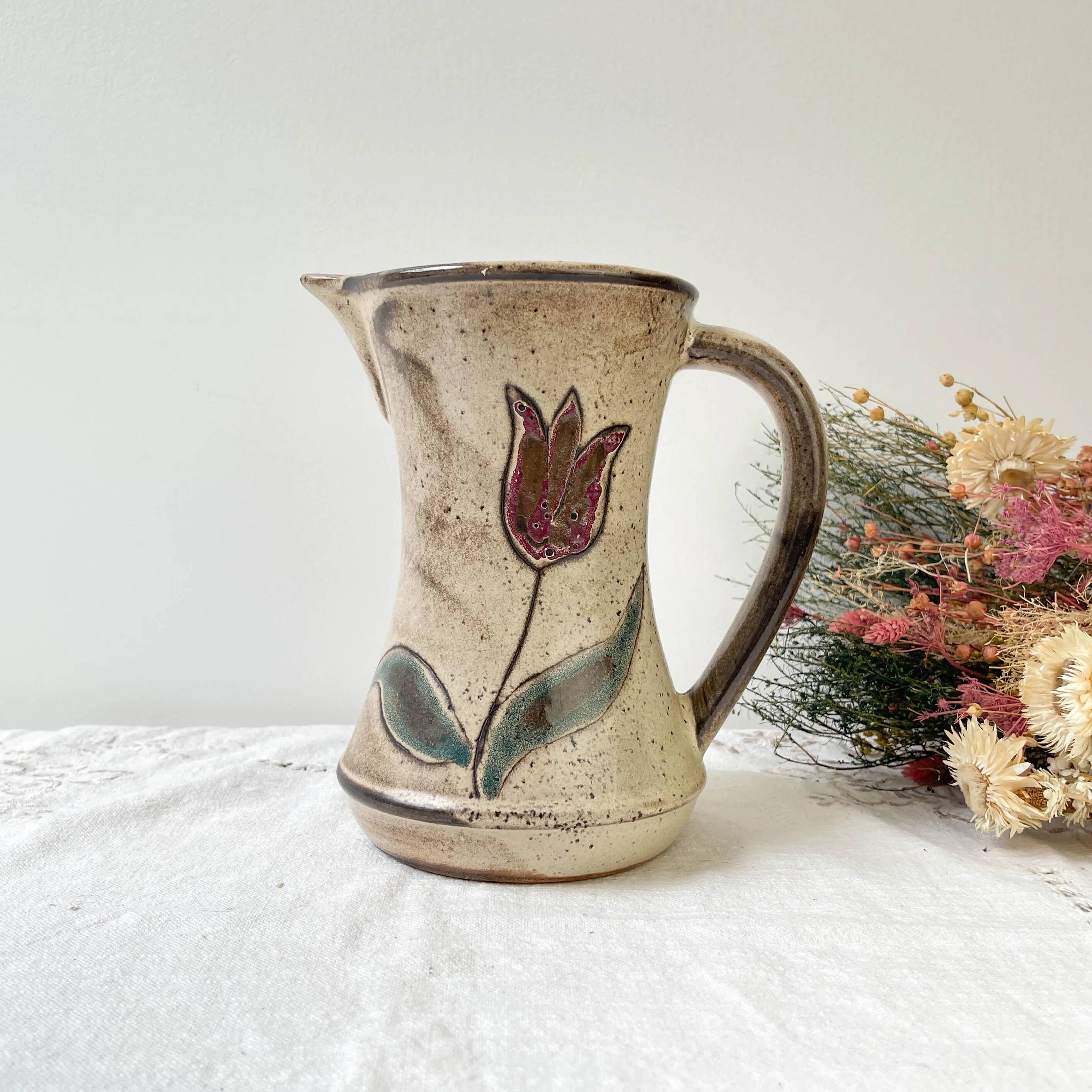 Ceramic pitcher from Les grottes dieulefit with floral pattern from the 1970s