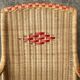 Vintage braided rattan armchair