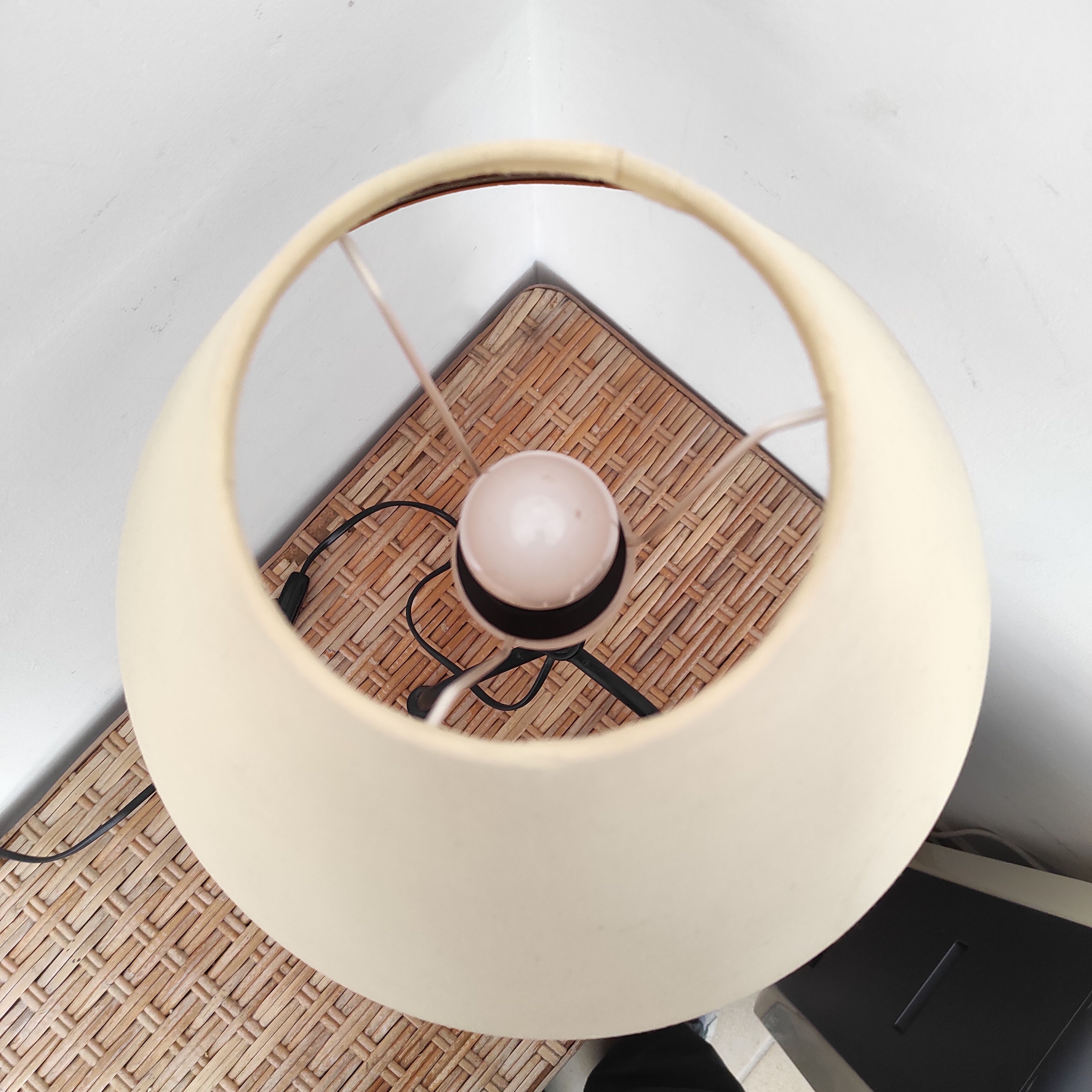 Black wrought iron table lamp and beige lampshade