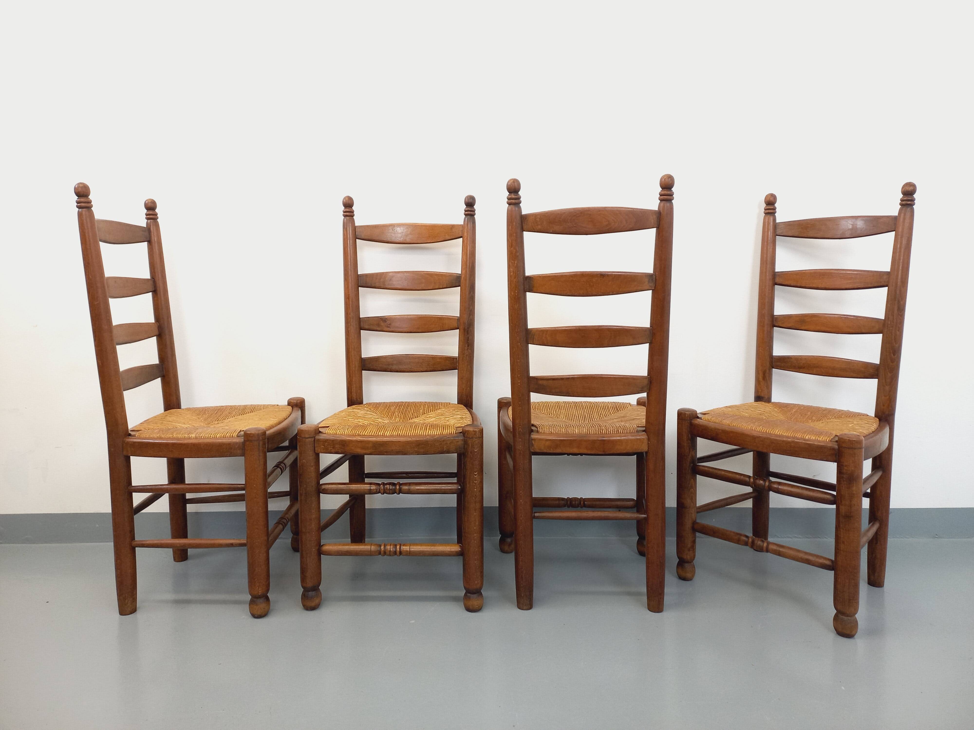Set of 4 vintage brutalist Charles Dudouyt chairs in wood and straw from the 60s