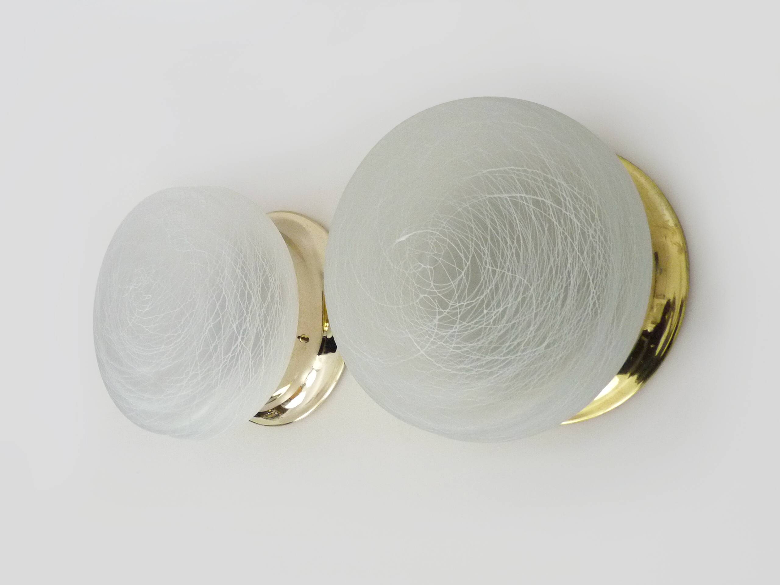 Pair of wall or ceiling lights with white-edged globe. 80 years