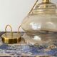 Vintage pendant lamp in electrified golden glass to nine