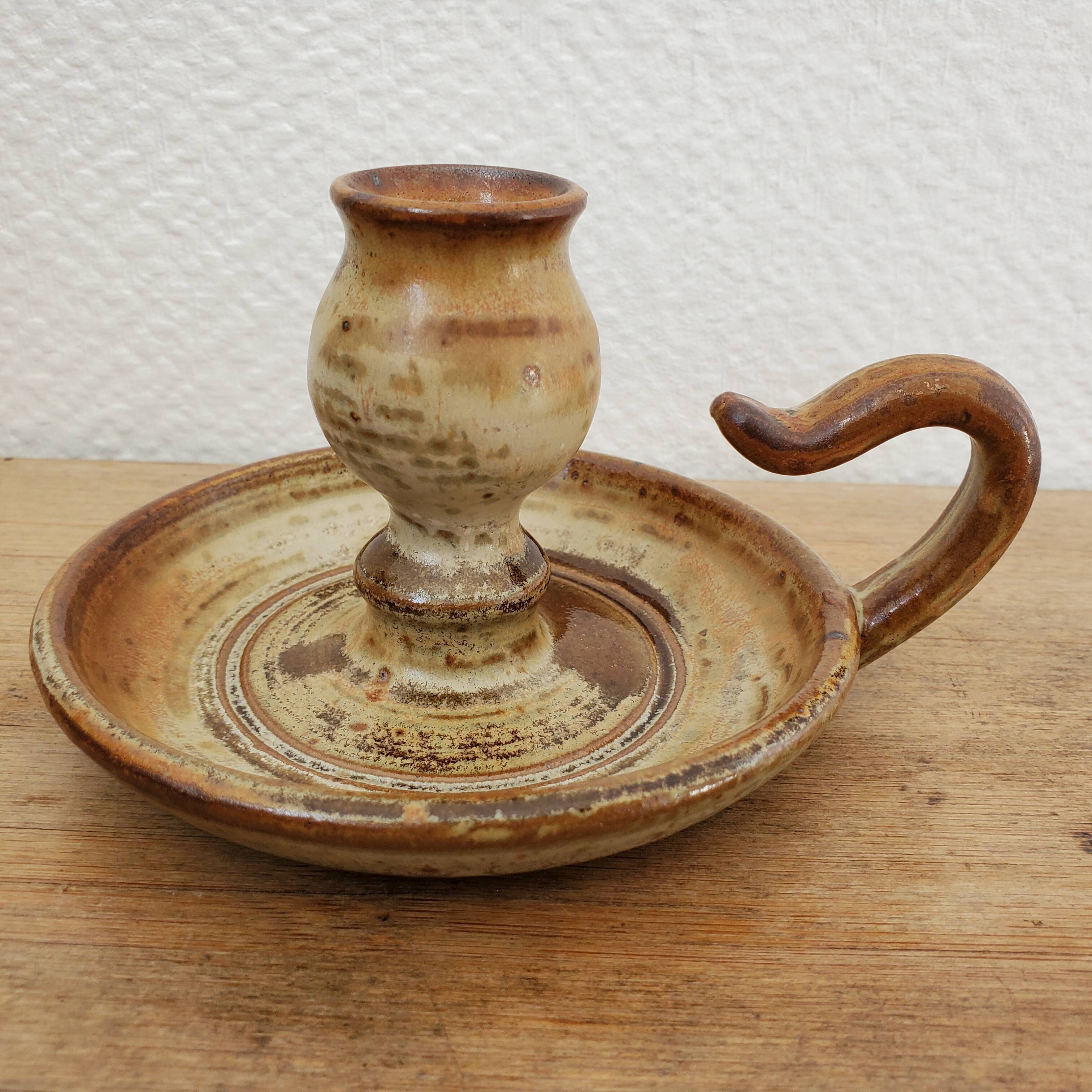 Sandstone candle holder called cellar rat