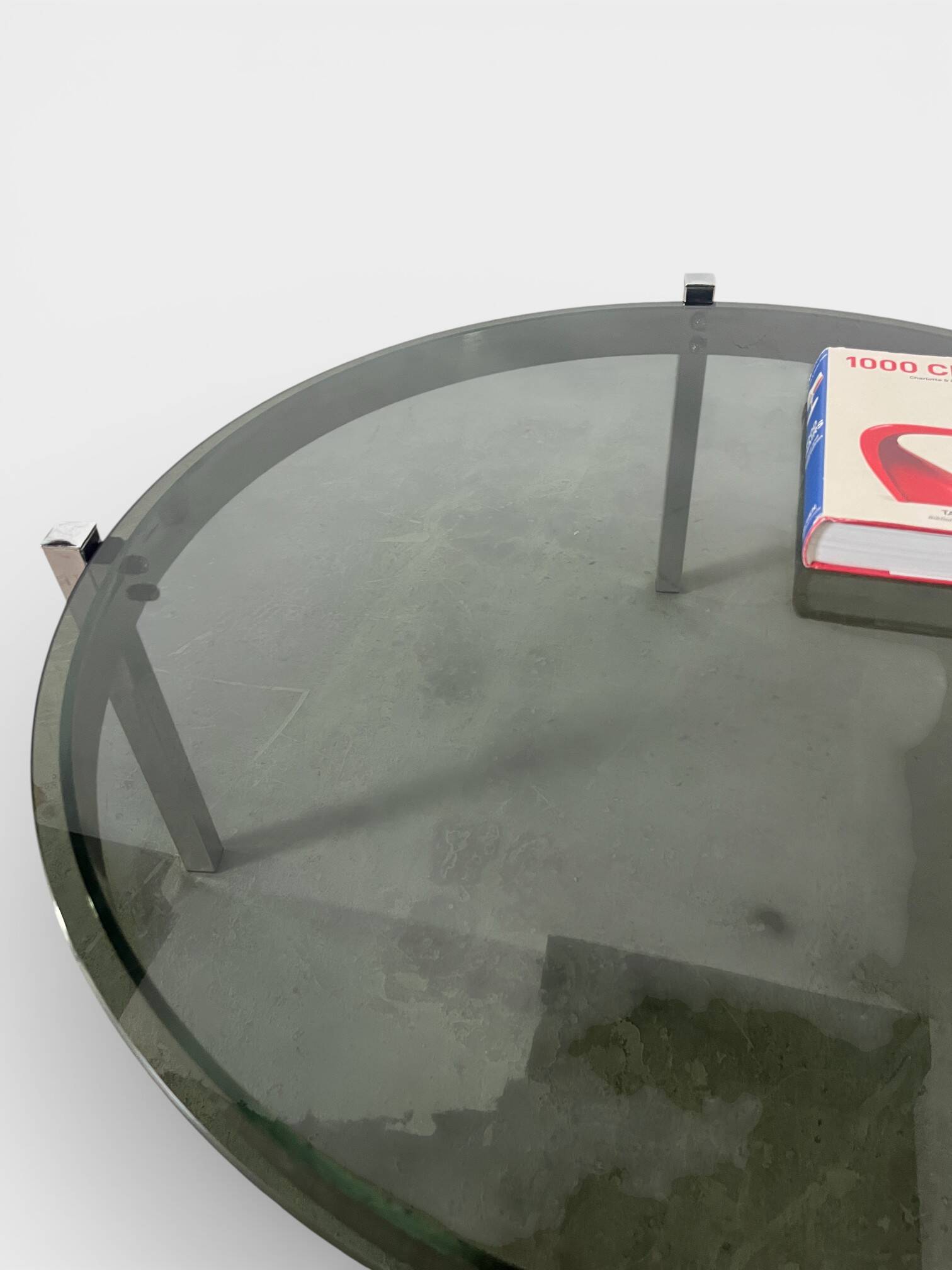 Vintage round coffee table with smoked glass and chrome.