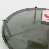 Vintage round coffee table with smoked glass and chrome.
