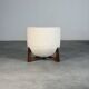 Totemo stool by forme, ivory dedar bouclé upholstery, walnut legs