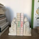 Pair of greenhouses book cat