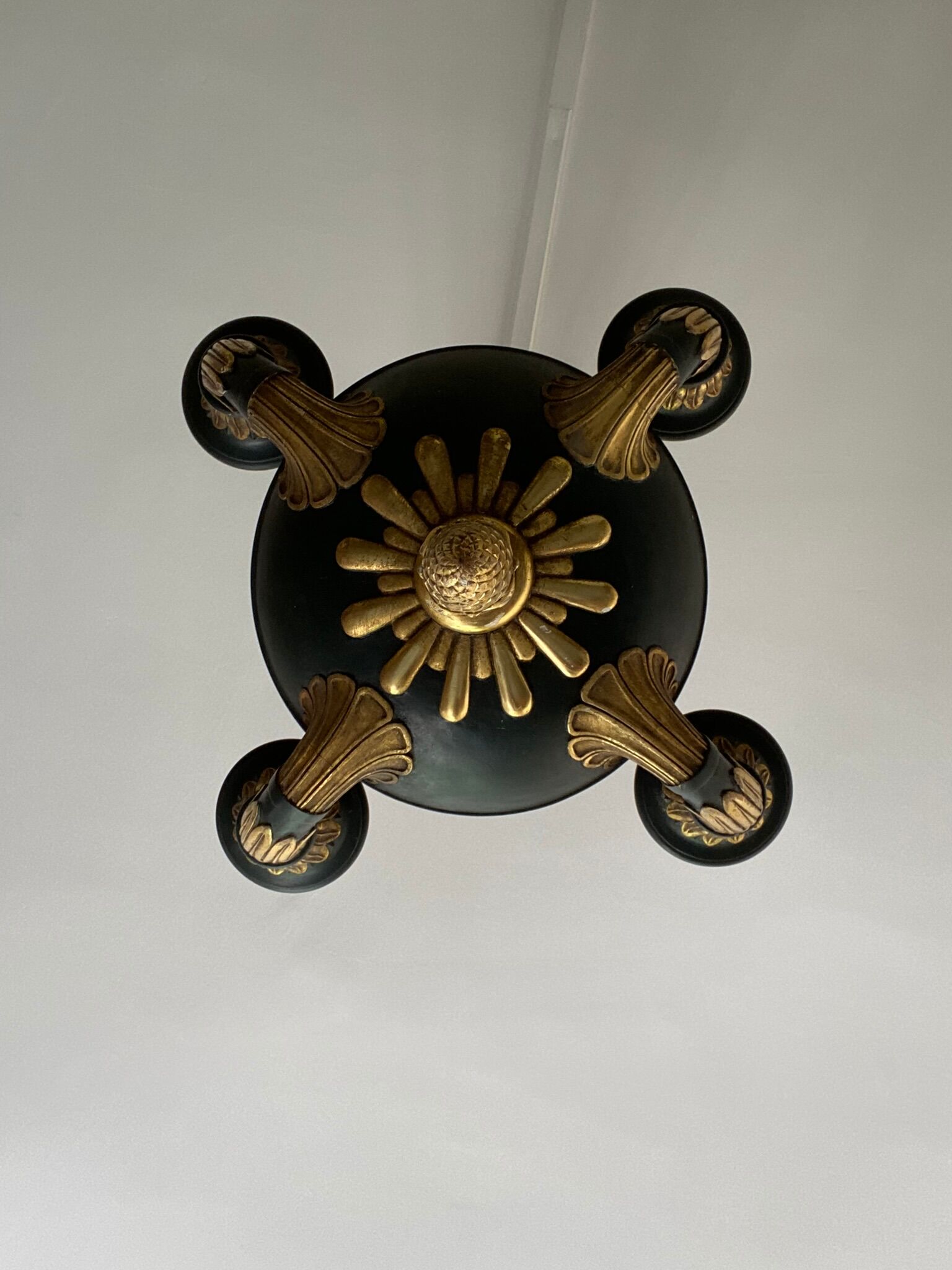 Empire style chandelier with four lights in sheet metal, bronze with patina and gilding