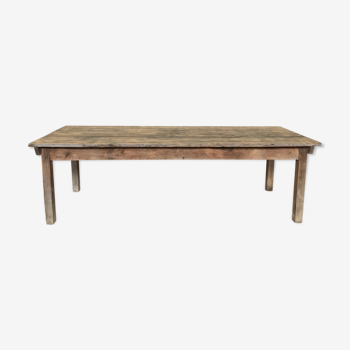 Old large farmhouse table dating from the early 20th century in fir wood