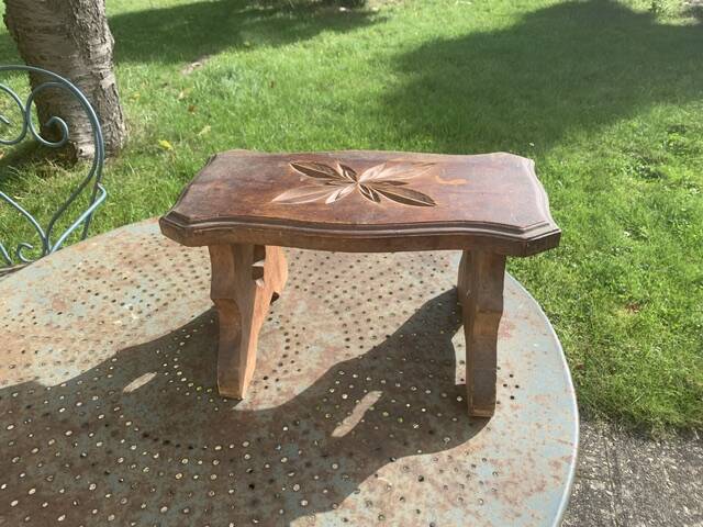 Bench in carved and varnished wood, mountain chalet decoration, old