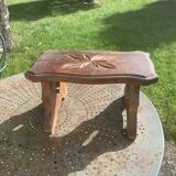 Bench in carved and varnished wood, mountain chalet decoration, old