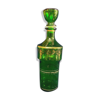 Green glass bottle and Louis style gilding