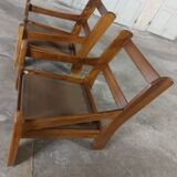 Armchairs in leather and vintage wood 70's