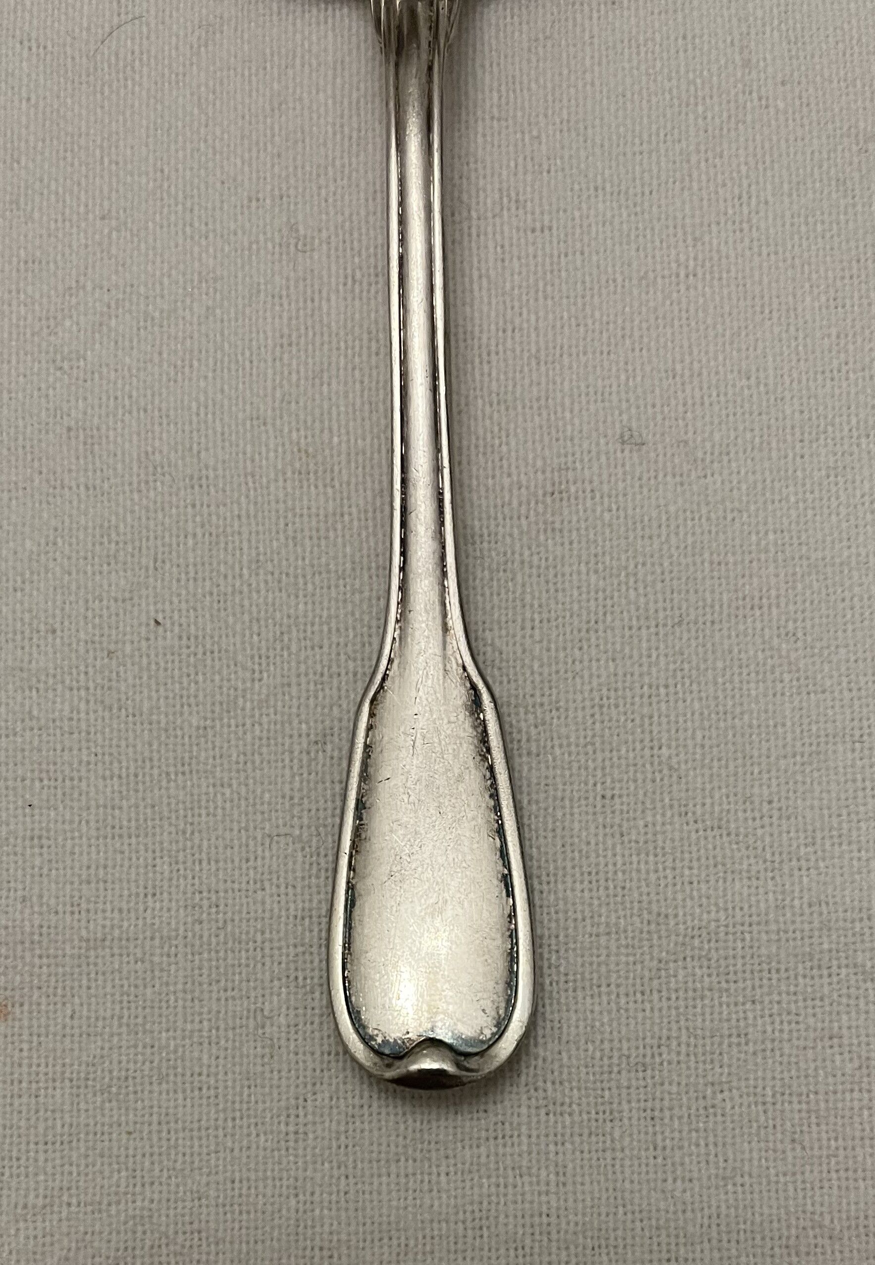 Silver metal sauce spoon