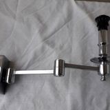Wall lamp with articulated arm