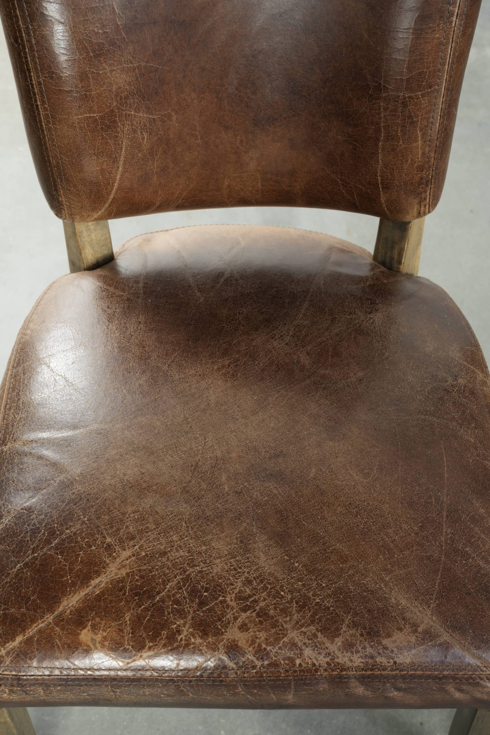 Set of 4 vintage cowhide and wooden dining chairs