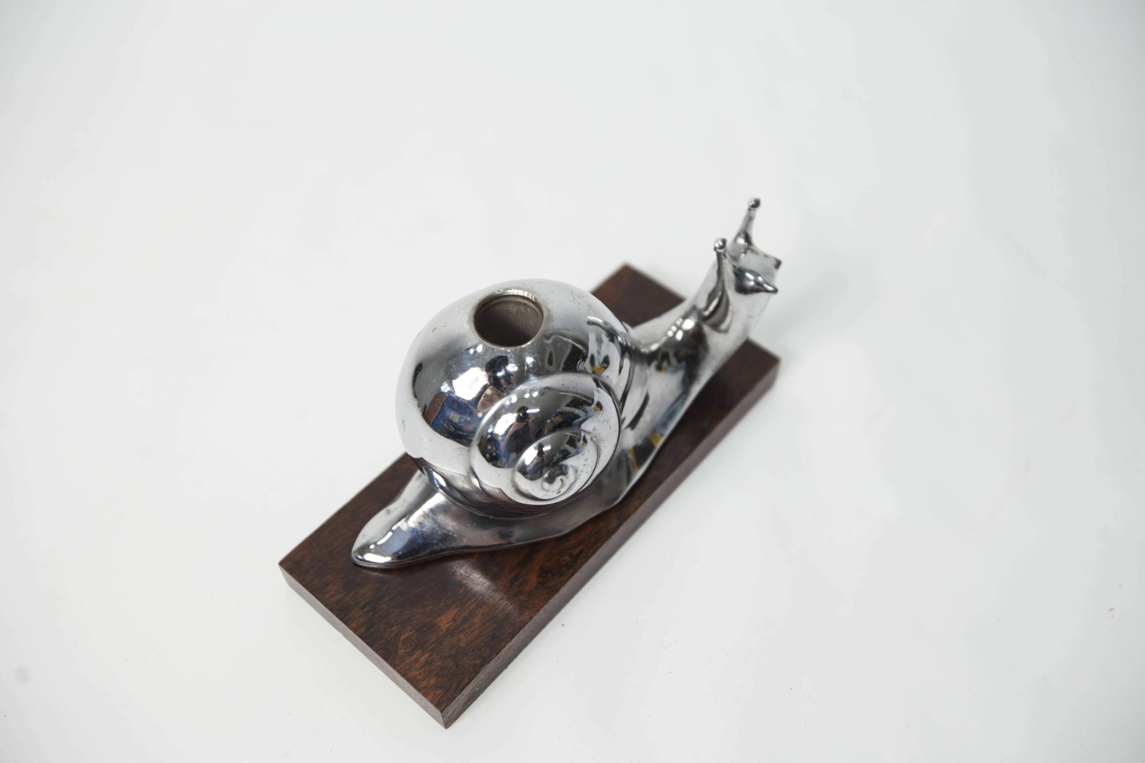 Silver snail candlestick on a teak base 1960