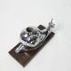 Silver snail candlestick on a teak base 1960