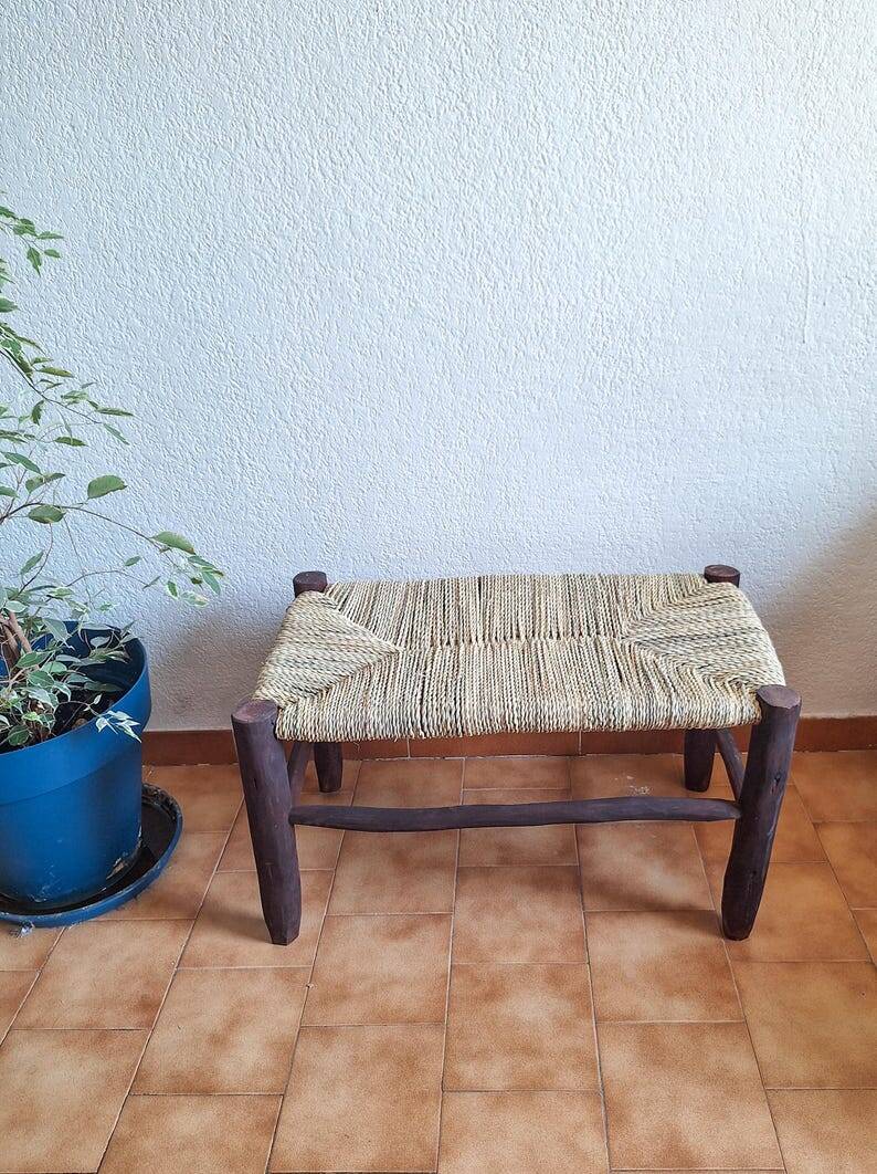 Moroccan bench in dark wood with woven palm leaf seat