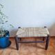 Moroccan bench in dark wood with woven palm leaf seat
