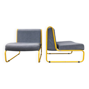 Pair of designer armchairs by Henri Julien