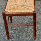Paire de tabourets années 50 en bois et assise paillée